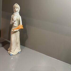 Elegant Ceramic Figurine with Orange Accent